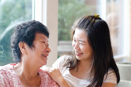 simsearch:400-04400433,k - Asian family, adult daughter having conversation with senior mother indoor. Stock Photo - Budget Royalty-Free & Subscription, Code: 400-06087216