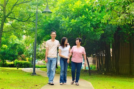 Asian adult having a outdoor walk with senior mother Stock Photo - Budget Royalty-Free & Subscription, Code: 400-06087217