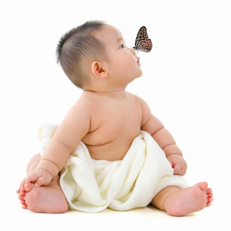 family healthy candid - Butterfly flying to Asian baby boy nose, on white background Stock Photo - Budget Royalty-Free & Subscription, Code: 400-06087220