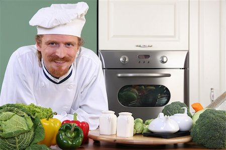 simsearch:400-04116514,k - Young chef with vegetables, preparing lunch in kitchen Stockbilder - Microstock & Abonnement, Bildnummer: 400-06087312