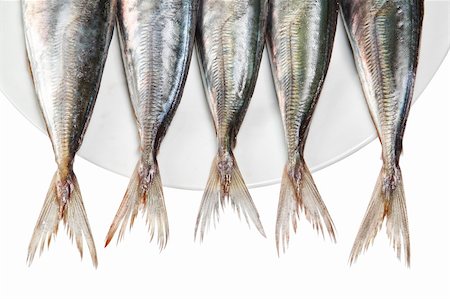 sergioua (artist) - Tails of raw mackerel on a plate. On a white background. Photographie de stock - Aubaine LD & Abonnement, Code: 400-06087516