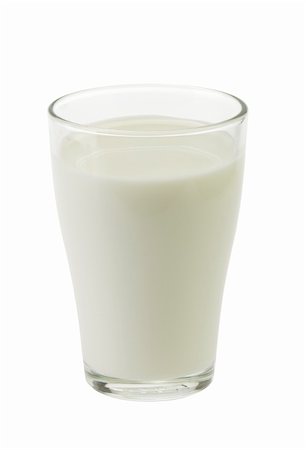 prasolov (artist) - milk is poured into a glass on a white background isolated Fotografie stock - Microstock e Abbonamento, Codice: 400-06087815