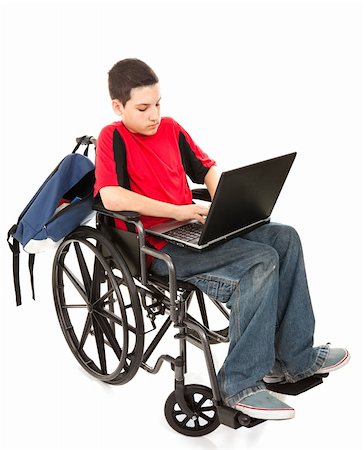 Disabled teen boy using a laptop computer.  Full body isolated on white. Stock Photo - Budget Royalty-Free & Subscription, Code: 400-06088084