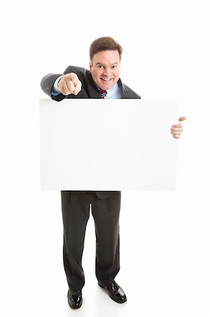 simsearch:400-05347520,k - Full body isolated view of a businessman holding a blank white sign. Photographie de stock - Aubaine LD & Abonnement, Code: 400-06088081