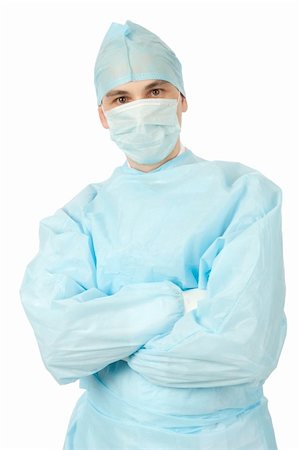 doctor with cap and mask - Male surgeon in uniform with arms crossed on white background Stock Photo - Budget Royalty-Free & Subscription, Code: 400-06089161