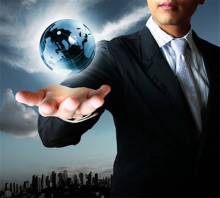 holding a glowing earth globe in his hands Stock Photo - Budget Royalty-Free & Subscription, Code: 400-06089187