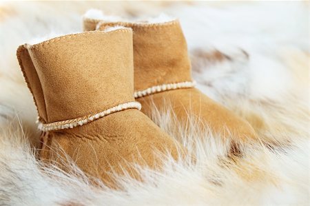 Pair of brown winter boots on fox fur background Stock Photo - Budget Royalty-Free & Subscription, Code: 400-06080021