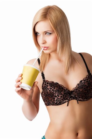 simsearch:400-04406789,k - young and sexy blond girl wearing brown bra and drinking from a paper cup isolated aver white, she is turned of three quarters, takes the straw near the mouth and looks in front of her Foto de stock - Super Valor sin royalties y Suscripción, Código: 400-06080390