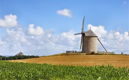 Traditional windmill in the vicinity of Mont Saint Michel monastery in Base Normandy in France.This is "Le Moulin Moidrey". Photographie de stock - Aubaine LD & Abonnement, Code: 400-06080487