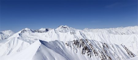 simsearch:400-08671175,k - Panorama of winter mountains. Caucasus Mountains, Georgia, view from ski resort Gudauri. Stock Photo - Budget Royalty-Free & Subscription, Code: 400-06082176