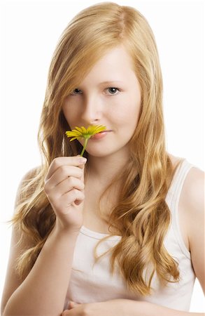 A pretty girl with a yellow flower, isolated on white background Stock Photo - Budget Royalty-Free & Subscription, Code: 400-06082191