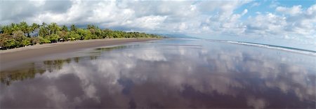 Panoramic view at the beach of Matapalo, Costa Rica. Matapalo is located in the Southern Pacific Coast. The main attractions are surfing and eco-tourism., Matapalo Stock Photo - Budget Royalty-Free & Subscription, Code: 400-06082588