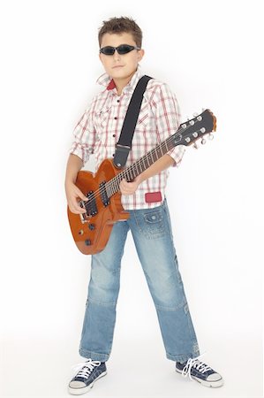 simsearch:400-04921650,k - Boy playing with a guitar over white Stock Photo - Budget Royalty-Free & Subscription, Code: 400-06082849