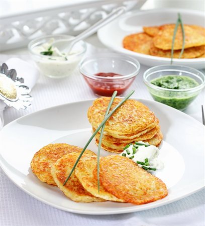 Potatoe pancakes with three different dips Stock Photo - Budget Royalty-Free & Subscription, Code: 400-06082981