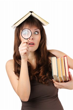 girl student with books and magnifying glass. Isolated at white background Stock Photo - Budget Royalty-Free & Subscription, Code: 400-06083281