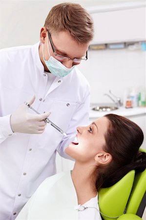 female with dental tools at work - The dentist makes an injection at the clinic Stock Photo - Budget Royalty-Free & Subscription, Code: 400-06083405