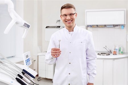 simsearch:400-04340942,k - A young dentist with instruments in the clinic Stock Photo - Budget Royalty-Free & Subscription, Code: 400-06083412