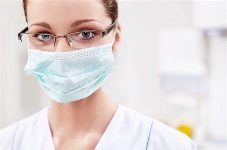 female dentist with mask - The doctor in a mask Stock Photo - Budget Royalty-Free & Subscription, Code: 400-06083420