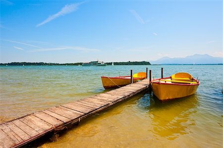 simsearch:400-05711959,k - Yellow Boats Moored on the Lake  Chiemsee Stock Photo - Budget Royalty-Free & Subscription, Code: 400-06083516