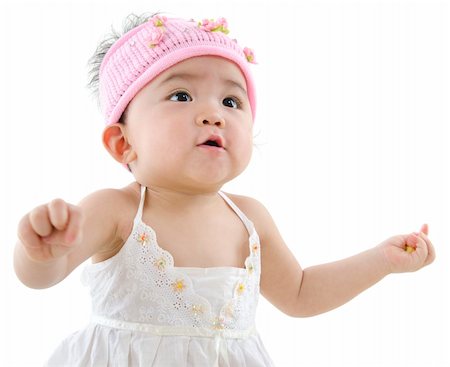 Happy 10 month old pan asian baby girl in pink flower hat Stock Photo - Budget Royalty-Free & Subscription, Code: 400-06083648