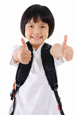 Thumbs up primary school girl with backpack on white background Stock Photo - Budget Royalty-Free & Subscription, Code: 400-06083651