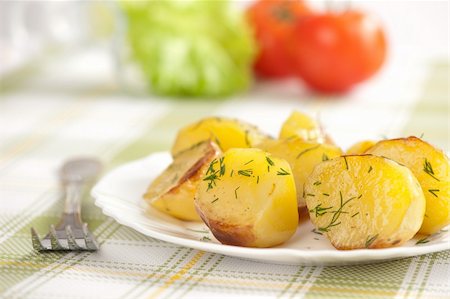 Baked potatoes on a plate Foto de stock - Super Valor sin royalties y Suscripción, Código: 400-06094201