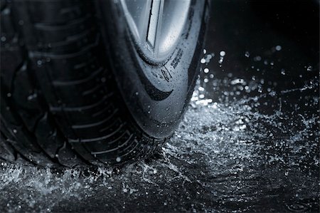 Car tire splashing in water. Stock Photo - Budget Royalty-Free & Subscription, Code: 400-06094712