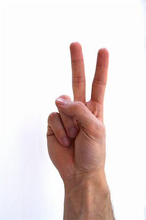 peace symbol with hands - Human hand shows peace symbol, number 2 with fingers on white background. Stock Photo - Budget Royalty-Free & Subscription, Code: 400-06094746