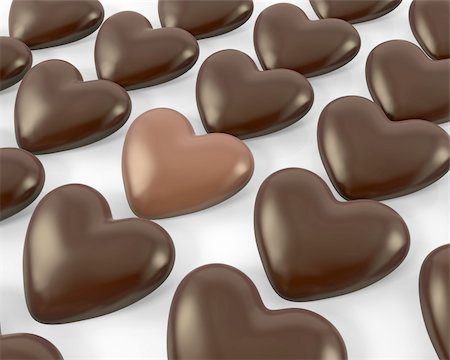 passionate fat pic - Heart shaped milk chocolate candy between dark ones, isolated on white background Stock Photo - Budget Royalty-Free & Subscription, Code: 400-06096436