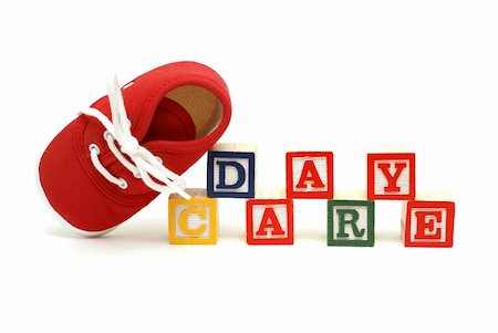 simsearch:400-04255559,k - An infants shoe next to the words day care. Stock Photo - Budget Royalty-Free & Subscription, Code: 400-06096683