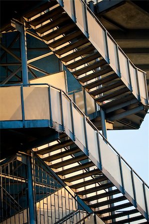 simsearch:400-07062573,k - Construction of steel blue colored staircase in the rays of the sun Stock Photo - Budget Royalty-Free & Subscription, Code: 400-06097020