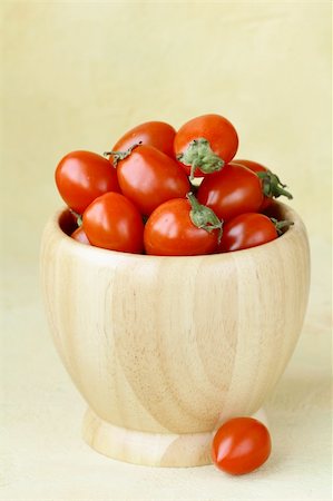 small cherry tomatoes in a wooden bowl Stock Photo - Budget Royalty-Free & Subscription, Code: 400-06097072