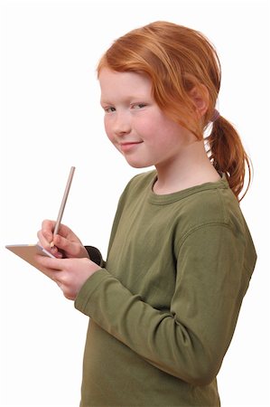 simsearch:400-05329645,k - Young girl writes in a notebook on white background Stock Photo - Budget Royalty-Free & Subscription, Code: 400-06097273
