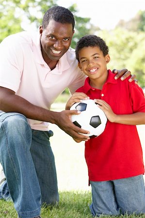 Father And Son In Park With Football Stock Photo - Budget Royalty-Free & Subscription, Code: 400-06097409