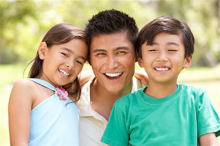filipino family portrait - Father With Children In Park Stock Photo - Budget Royalty-Free & Subscription, Code: 400-06097505