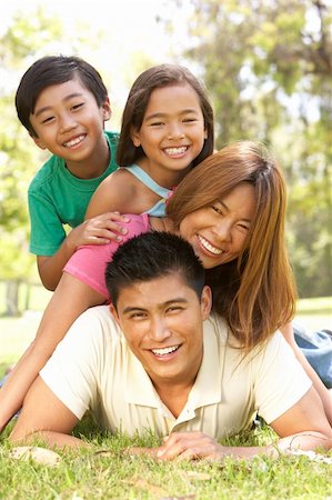 filipino family portrait - Family Enjoying Day In Park Stock Photo - Budget Royalty-Free & Subscription, Code: 400-06097509