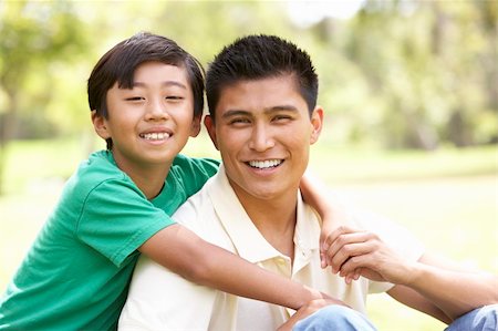 filipino family portrait - Father And Son In Park Stock Photo - Budget Royalty-Free & Subscription, Code: 400-06097502