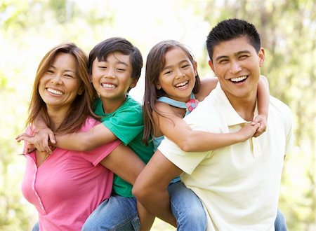 filipino family portrait - Family Enjoying Day In Park Stock Photo - Budget Royalty-Free & Subscription, Code: 400-06097521