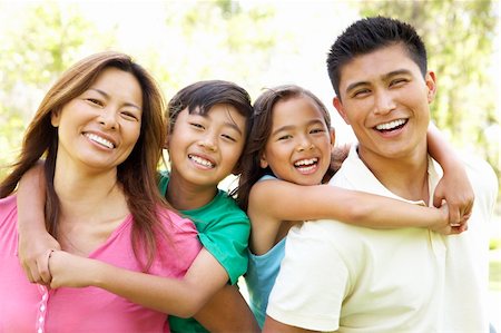 filipino family portrait - Family Enjoying Day In Park Stock Photo - Budget Royalty-Free & Subscription, Code: 400-06097522