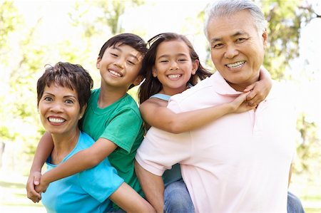 filipino family portrait - Portrait Of Grandparents With Grandchildren In Park Stock Photo - Budget Royalty-Free & Subscription, Code: 400-06097550