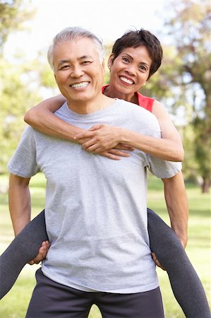 simsearch:400-05735475,k - Senior Couple Working Out In Park Stock Photo - Budget Royalty-Free & Subscription, Code: 400-06097574