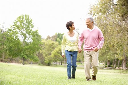 Senior Couple Walking In Park Stock Photo - Budget Royalty-Free & Subscription, Code: 400-06097609