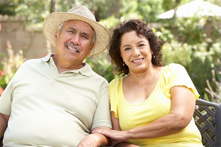 Senior Couple Relaxing In Garden Together Stock Photo - Budget Royalty-Free & Subscription, Code: 400-06097672