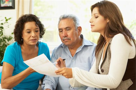 financial advisor talking to couple - Senior Couple With Financial Advisor At Home Stock Photo - Budget Royalty-Free & Subscription, Code: 400-06097702