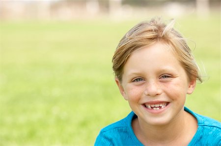 seven years old girls - Portrait Of Young Girl Sitting In Park Stock Photo - Budget Royalty-Free & Subscription, Code: 400-06097825