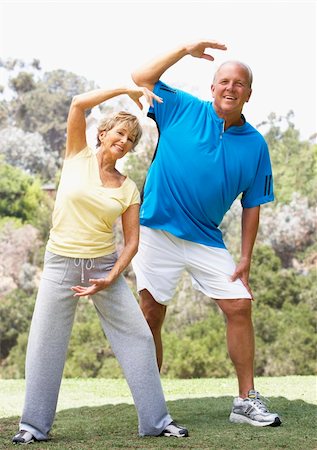 simsearch:400-05735475,k - Senior Couple Exercising In Park Stock Photo - Budget Royalty-Free & Subscription, Code: 400-06097858