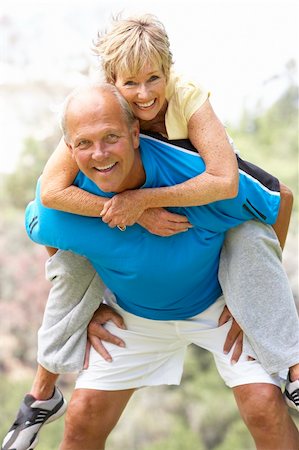 simsearch:400-05735475,k - Senior Couple Exercising In Park Stock Photo - Budget Royalty-Free & Subscription, Code: 400-06097859