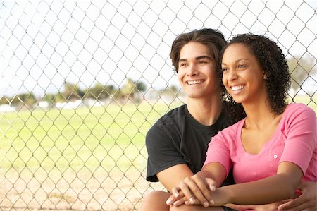 simsearch:400-06097939,k - Teenage Girls Sitting Together In Playground Foto de stock - Super Valor sin royalties y Suscripción, Código: 400-06097928