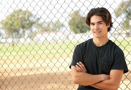 Teenage Boy Sitting In Playground Foto de stock - Super Valor sin royalties y Suscripción, Código: 400-06097947