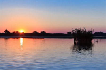 danube delta - a beautiful sunrise on the lake. Danube Delta, Romania Stock Photo - Budget Royalty-Free & Subscription, Code: 400-06098631